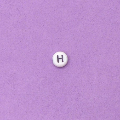 1 ks Korálek s písmeny H - černá písmena na bílém podkladu 7 x 3 mm